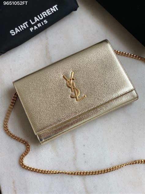 gold YSL clutch